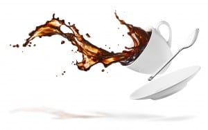 cup of spilling coffee creating splash